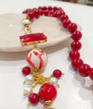 Collana lunga rossa con sferetta in ceramica