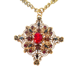 Collana con ciondolo con dettagli floreali in ottone e cristalli