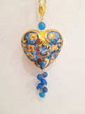 Collana con cuore sacro decorato