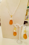 Set collana e orecchini in ambra e perle naturali