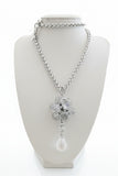 Set collana e orecchini argentati con fiore di cristalli