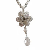 Set collana e orecchini argentati con fiore di cristalli