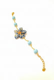 Bracciale con fiore in ceramica e perle in pasta di turchese