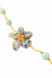 Bracciale con fiore in ceramica e perle in pasta di turchese