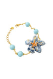 Bracciale con fiore in ceramica e perle in pasta di turchese