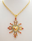 Collana dorata con ex voto cuore sacro e raggi