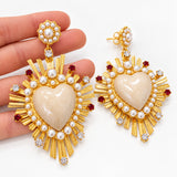 Orecchini con cuore sacro crema