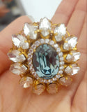 Anello ovale con cristallo centrale azzurro