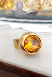 Anello tondo con cristallo centrale