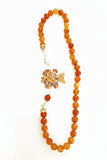Collana arancione con pesce in ceramica