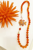 Collana arancione con pesce in ceramica