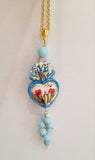 Collana con cuore sacro in ceramica decorato