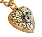 Collana con ciondolo cuore e rosa in rilievo