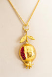 Set collana e orecchini con melograno in metallo dorato e cristalli rossi