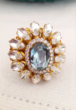 Anello ovale con cristallo centrale azzurro