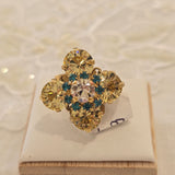 Anelli con motivo fiore con cristalli o smalti in vari colori